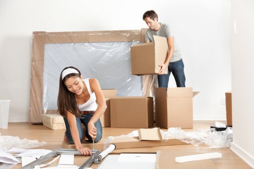 Furniture removal team handling a move in a Westminster street