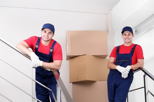 Residential moving van and packed boxes near a Westminster townhouse