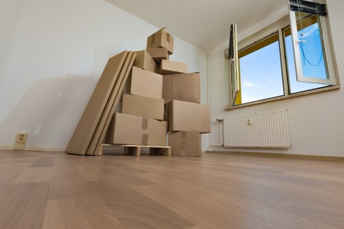 Packed household boxes and furniture ready for a Westminster home relocation