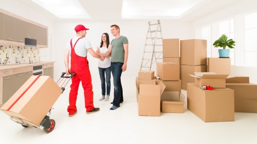 Staff handling boxes during a Westminster removal van service